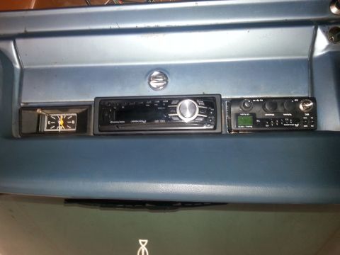 1982 Jeep Wagoneer - Aftermarket audio and communication equipment installed in a vehicle's dashboard.
