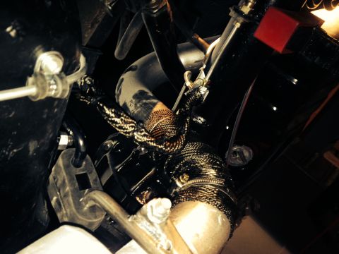 1965 Ford Mustang - 65 Mustang rear brake line and tail pipe wrapped with DEI titanium.