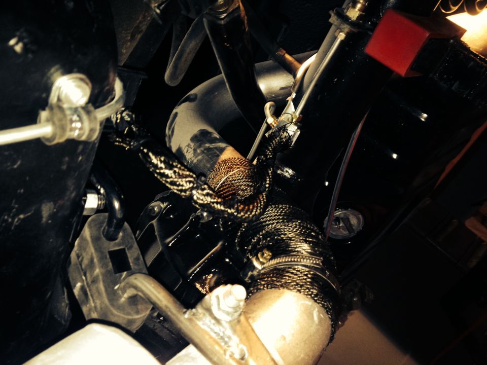 65 Mustang rear brake line and tail pipe wrapped with DEI titanium.