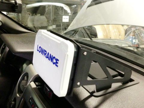 1988 Ford Bronco - A Lowrance device is mounted on the dashboard of a vehicle.