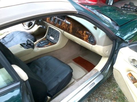 1998 Ford Crown Victoria - The interior of a Jaguar XK8 features wood trim and leather seats.