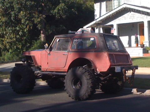 1968 Ford Mustang - This heavily modified off-road vehicle features oversized tires and a custom hardtop, suggesting it's built for terrain.
