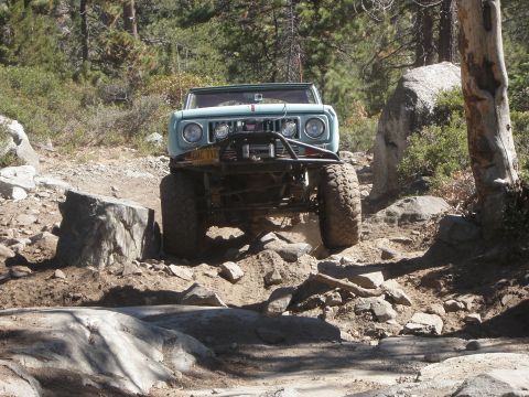 1961 International Scout 800 - This 1961 International Scout 800 navigates a challenging rocky terrain on an off-road trail.