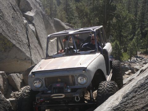 1961 International Scout 800 - Modified 1961 International Scout 800 navigating a challenging rocky trail.