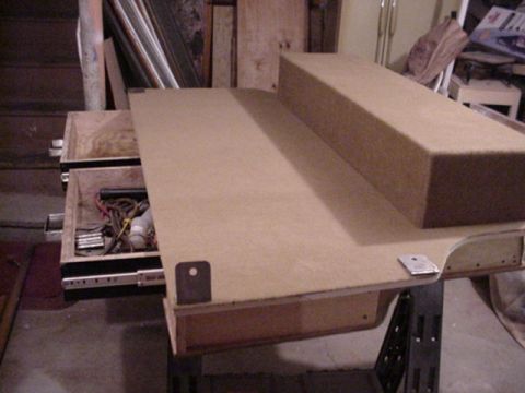 1993 Ford Bronco - Custom MDF and plywood center console box fabrication sitting on a workbench with an open drawer in a workshop.