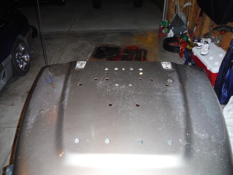 2005 Jeep Wrangler - Hood from a 2005 Jeep Wrangler, viewed from the underside, with numerous mounting holes visible.