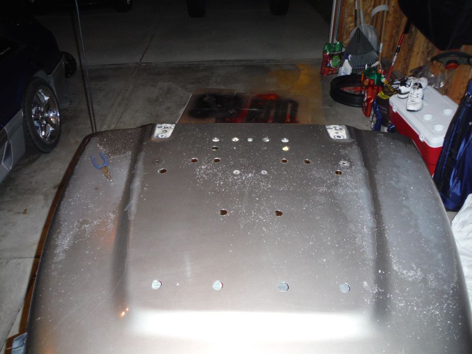 2005 Jeep Wrangler hood, showing mounting holes and some dust