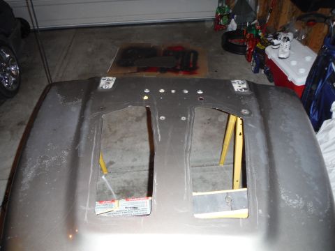 2005 Jeep Wrangler - A vehicle hood is shown from the underside, with two rectangular openings and visible mounting points.