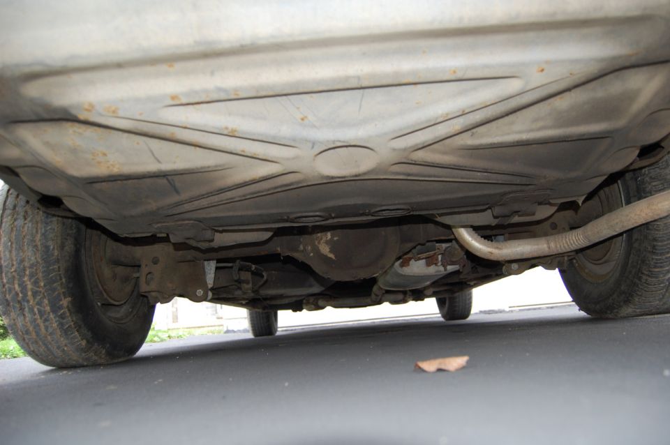 Underside view of a 1985 Mercury Grand Marquis showing the exhaust and rear differential