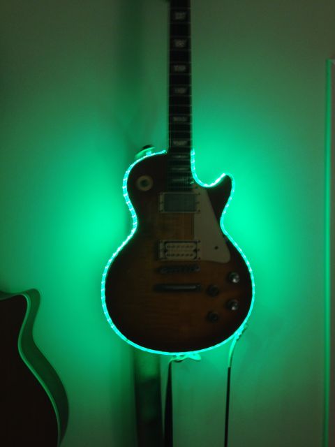 1989 Mazda MX-6 - Electric guitar illuminated by green LED lights.