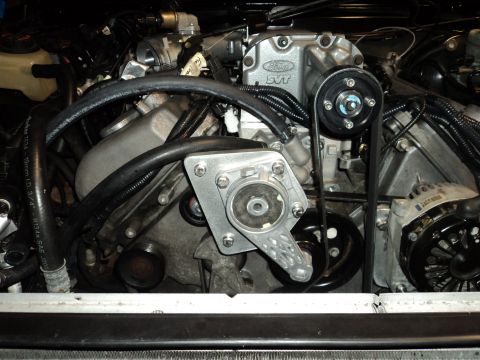 2004 Mercury Grand Marquis - Close-up view of a modified engine bay, showing a supercharger and associated components.