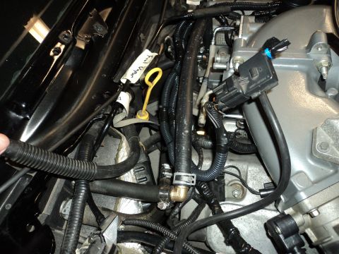 2004 Mercury Grand Marquis - Close-up of engine bay components, including fuel lines and wiring, with a label indicating 'Fuel Vapor'.