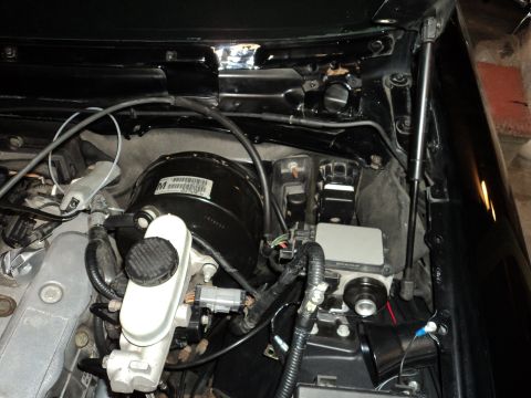 2004 Mercury Grand Marquis - Engine bay components including the brake booster and master cylinder are visible in this close-up shot.