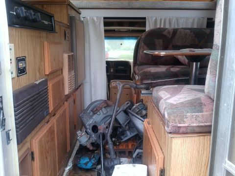 1984 Ford Bronco - Engine components are stored inside the living area of this camper van.