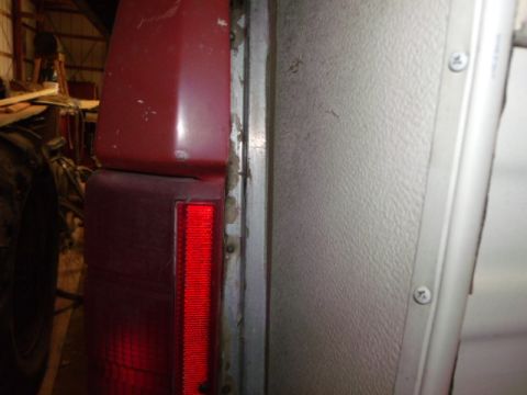 1984 Ford Bronco - Close-up view of the rear taillight and side panel of a 1984 Ford Bronco.