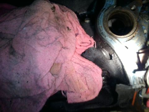 1984 Ford Bronco - A pink rag is placed over a greasy engine part, with the Supermotors.net logo visible in the lower right corner.