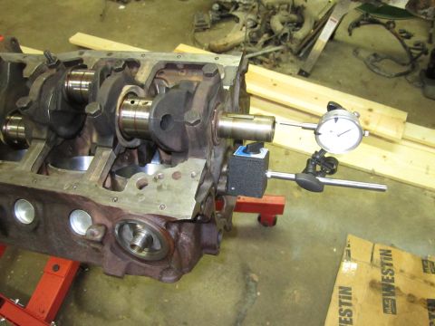 1984 Ford Bronco - Dial indicator measures crankshaft runout on an engine block during a rebuild.