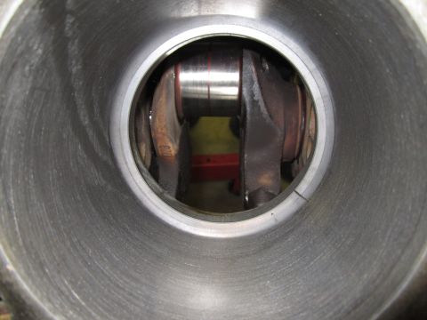 1984 Ford Bronco - Close-up view of an engine cylinder revealing the crankshaft and connecting rod mechanism.