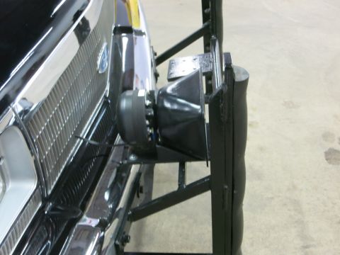 1991 Ford LTD Crown Victoria - Close-up of a black push bar and mounted spotlight set against the chrome grille and bumper of a dark Ford.