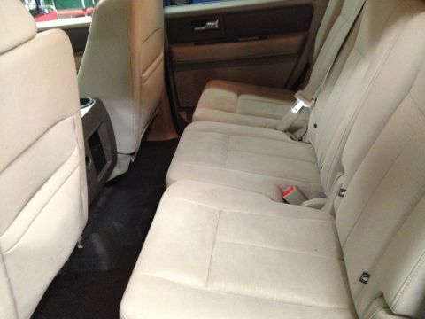 1991 Ford LTD Crown Victoria - Interior photograph of an SUV's tan second-row bench seats, not a technical document.