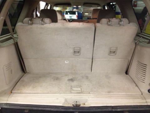 1991 Ford LTD Crown Victoria - Interior photograph of an SUV cargo area and folded rear seats, not a technical document.