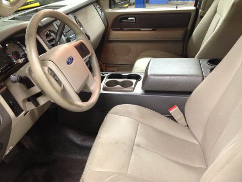1991 Ford LTD Crown Victoria - Interior photograph of an SUV front cabin with Ford steering wheel and center console, not a technical document.