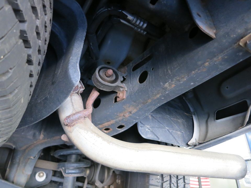 Undercarriage photo showing exhaust pipe, mounts and suspension