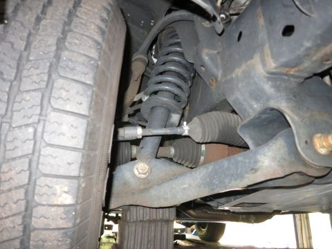 1991 Ford LTD Crown Victoria - Photograph of a vehicle's front suspension and steering components, not a technical document.