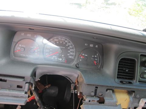 2001 Ford Crown Victoria - The interior of a 2001 Ford Crown Victoria shows a close-up of the dashboard gauges, including the speedometer, fuel gauge, and temperature…