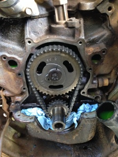 1996 Ford Bronco - Close-up view of a timing chain cover, the Supermotors logo at the bottom.