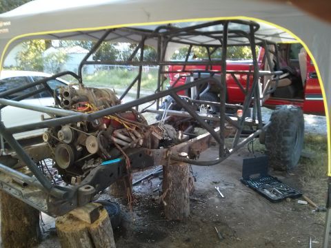 1986 Ford Bronco - This vehicle is undergoing extensive modification, with its frame and engine clearly visible.
