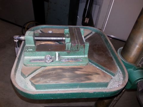 1997 Ford Ranger - Close-up of a green drill press vise, showing its screw and jaws.