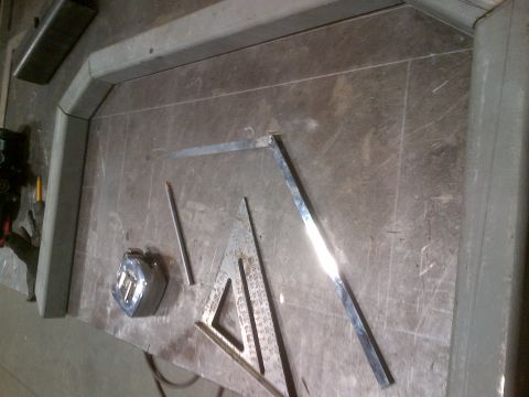 1985 Jeep CJ7 - Metal tubing is being fabricated on a workbench with various measuring and marking tools. The registry information does not match the visua…