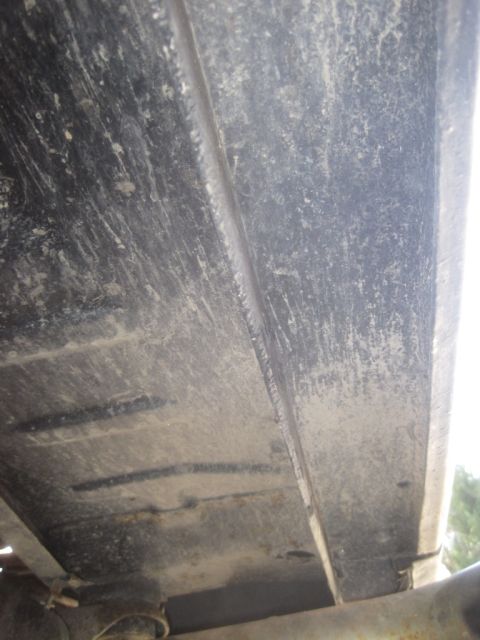 1993 Ford Bronco - The underside of a vehicle frame is shown, with no clear year identification visible.