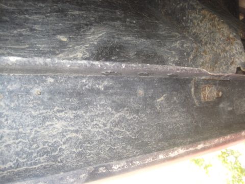 1993 Ford Bronco - Close-up view of the vehicle's undercarriage, showing frame details and some rust. The Supermotors.net logo is present in the lower right c…