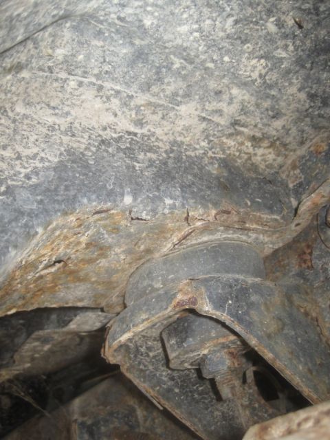 1993 Ford Bronco - This image shows heavily rusted frame and suspension components, indicating significant wear and tear.