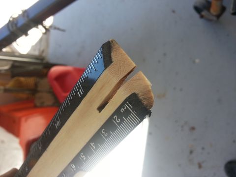 1994 Ford Bronco - A wooden ruler with measurement markings is shown, split at its tip.