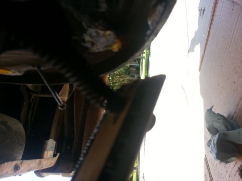 1994 Ford Bronco - Close-up of vehicle undercarriage, focusing on brake drum and associated hardware.