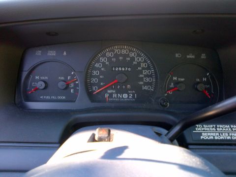 2001 Ford Crown Victoria - The dashboard gauges of a 2001 Ford Crown Victoria display the odometer reading of 125,976 miles.