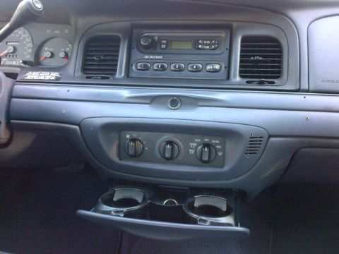 2001 Ford Crown Victoria - Interior view of a 2001 Ford Crown Victoria dashboard, showing the radio and climate controls.