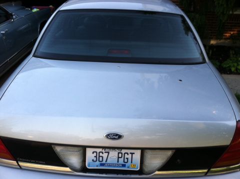 2001 Ford Crown Victoria - Rear view of a silver Ford Crown Victoria sedan showing the trunk lid, taillights and a Kentucky license plate reading 367 PGT.
