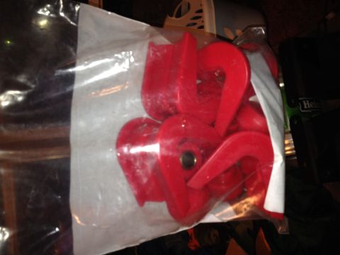 1995 Ford F-150 - A bag of red suspension bushings is shown, with a Supermotors.net watermark at the bottom.