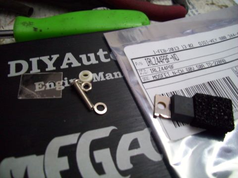 1995 Ford Probe - Electronic component and hardware are laid out on a black surface with text.