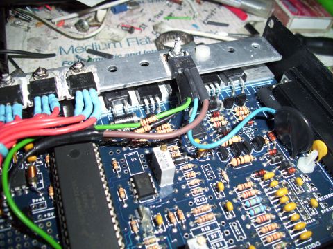 1995 Ford Probe - A detailed view of an electronic circuit board, showing various components like transistors, resistors, and colorful wires.