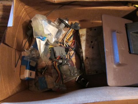 1991 Ford LTD Crown Victoria - A collection of automotive electrical components and wiring is stored in a cardboard box.