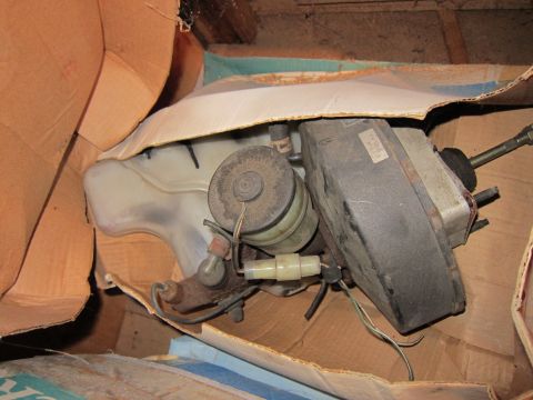 1991 Ford LTD Crown Victoria - A brake booster and master cylinder assembly is seen packed in a cardboard box.