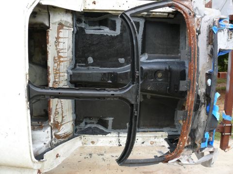 1976 Chevrolet Corvette interior floor pan and door frame with rust and sealant