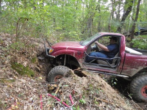 1983 Ford Bronco - Jon's bumper helped him get started up the pit face.