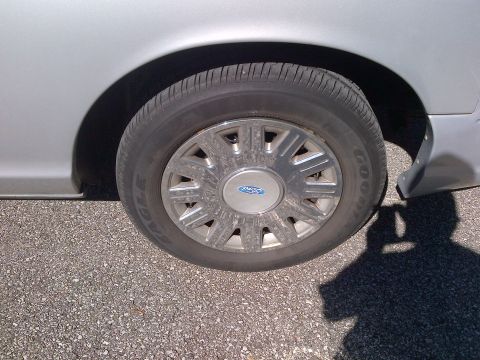 2001 Ford Crown Victoria - Close-up of a 2001 Ford Crown Victoria wheel and tire.