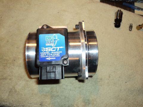 2004 Mercury Grand Marquis - A close-up of an SCT Big Air Mass Air Flow sensor, a component for engine tuning.